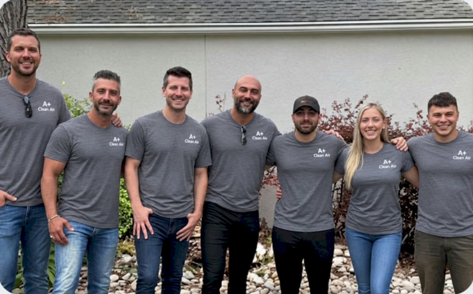 The Clean Air Duct Inc service team in branded gray shirts